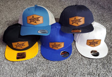 Load image into Gallery viewer, Five baseball caps in black, blue, yellow, white, and navy on a textured surface.
